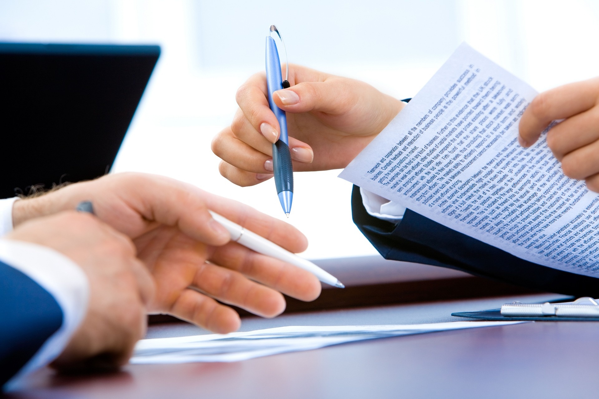People signing documents