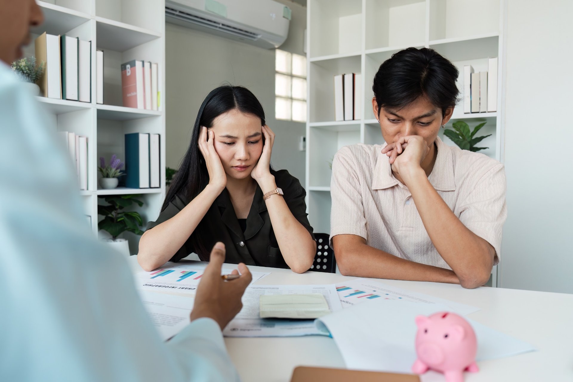 young couple planning savings and budget with financial adviser
