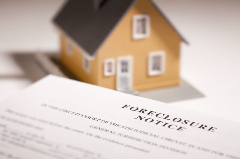 foreclosure-notice-and-model-home-on-gradated-background