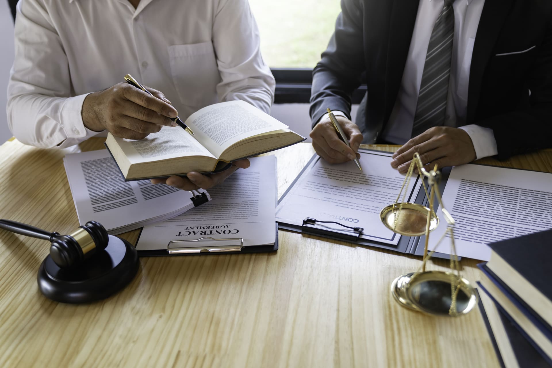 lawyers reading rule book