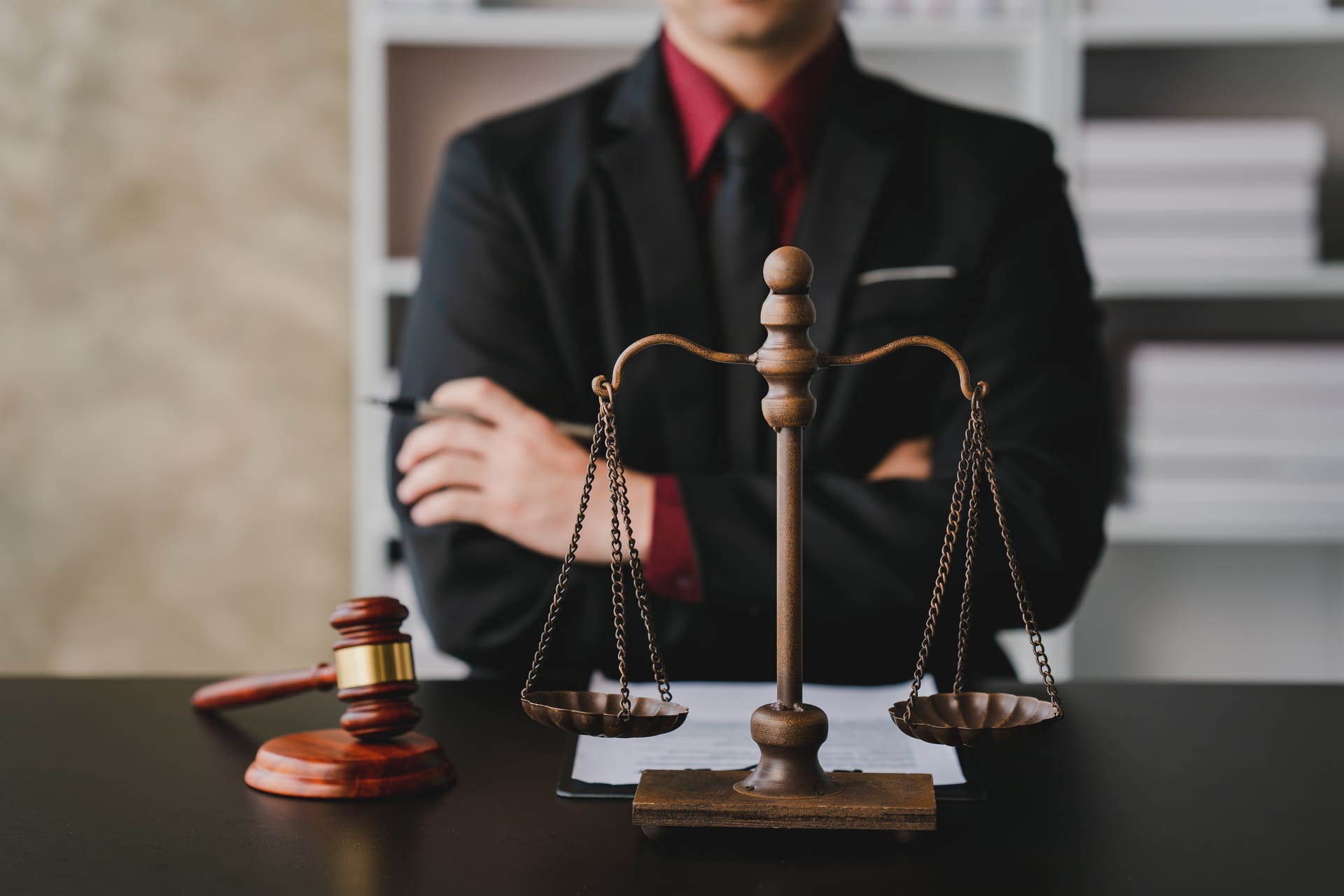 concept of justice, lawyer standing behind gavel and scales