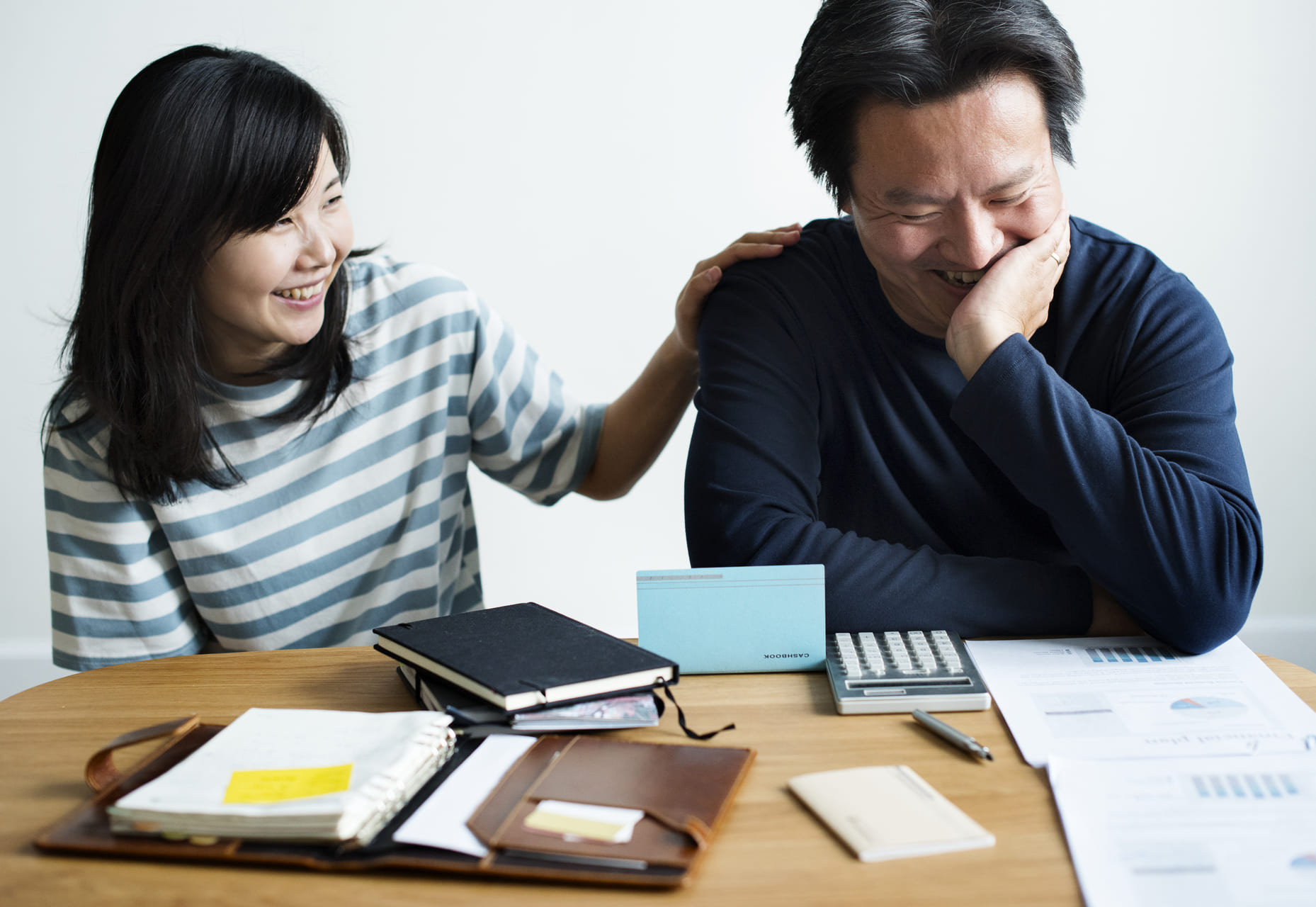 asian couple stressed about finances