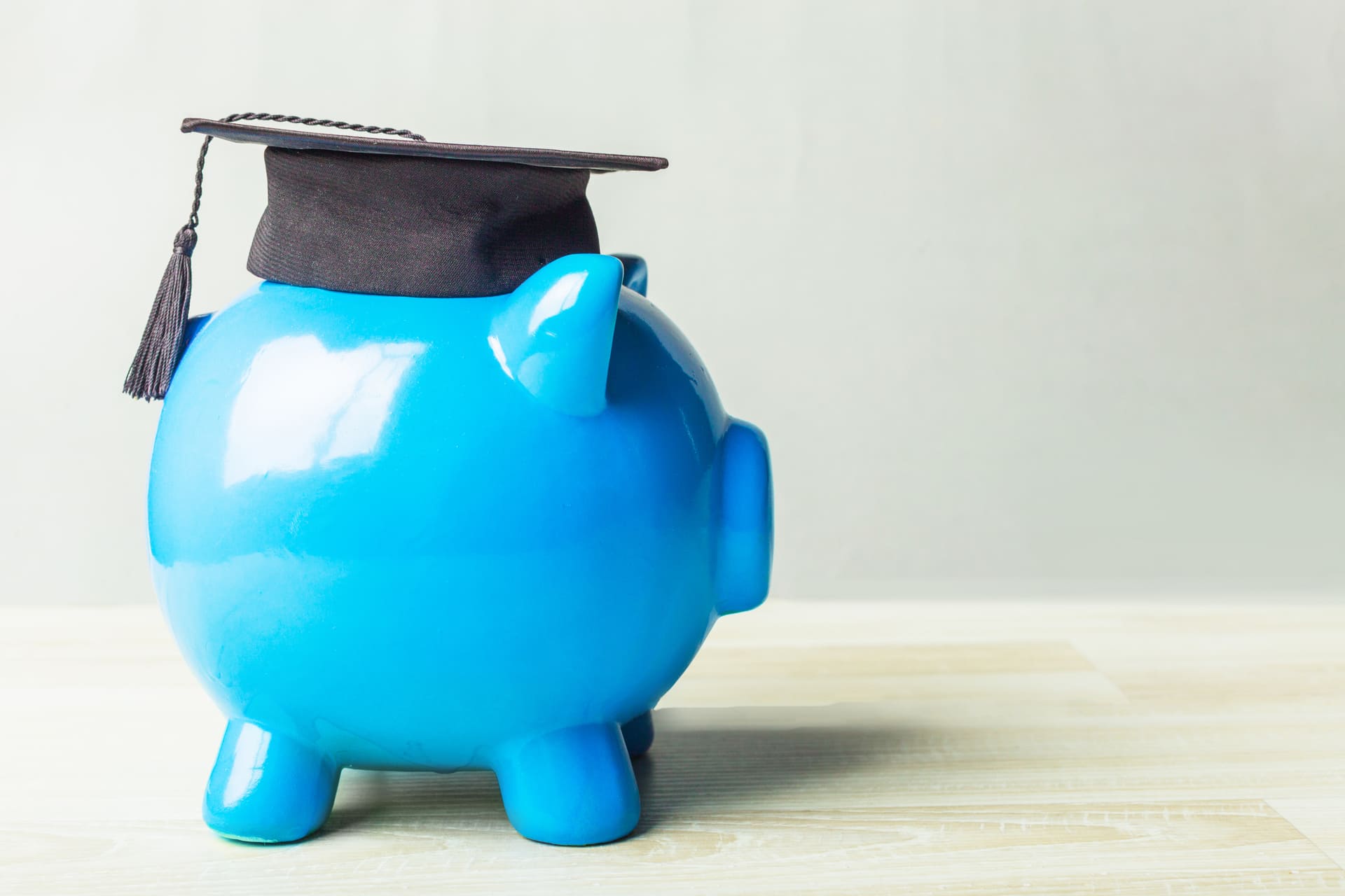 college-graduate-student-diploma-piggy-bank-concept