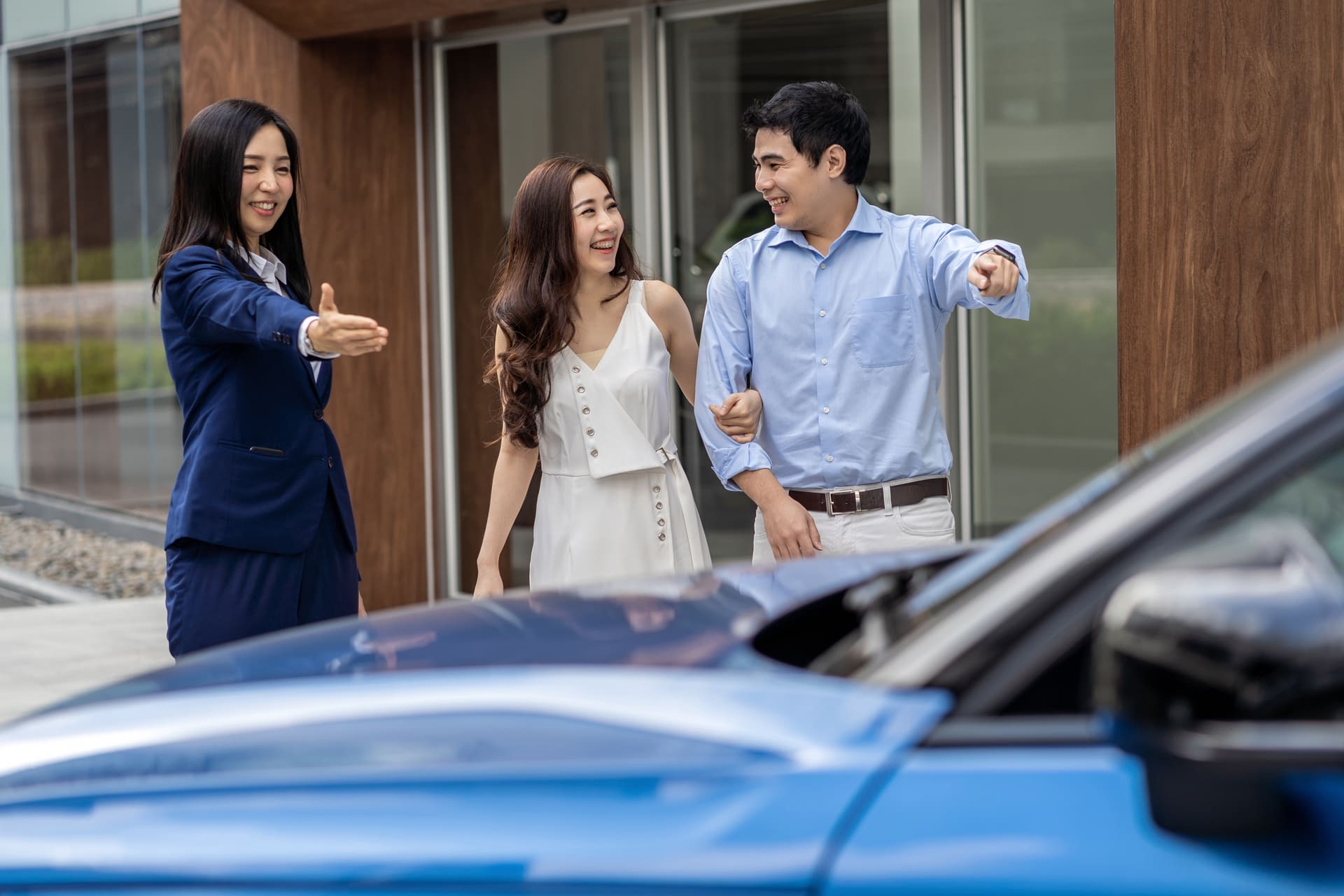 couple happy for new car