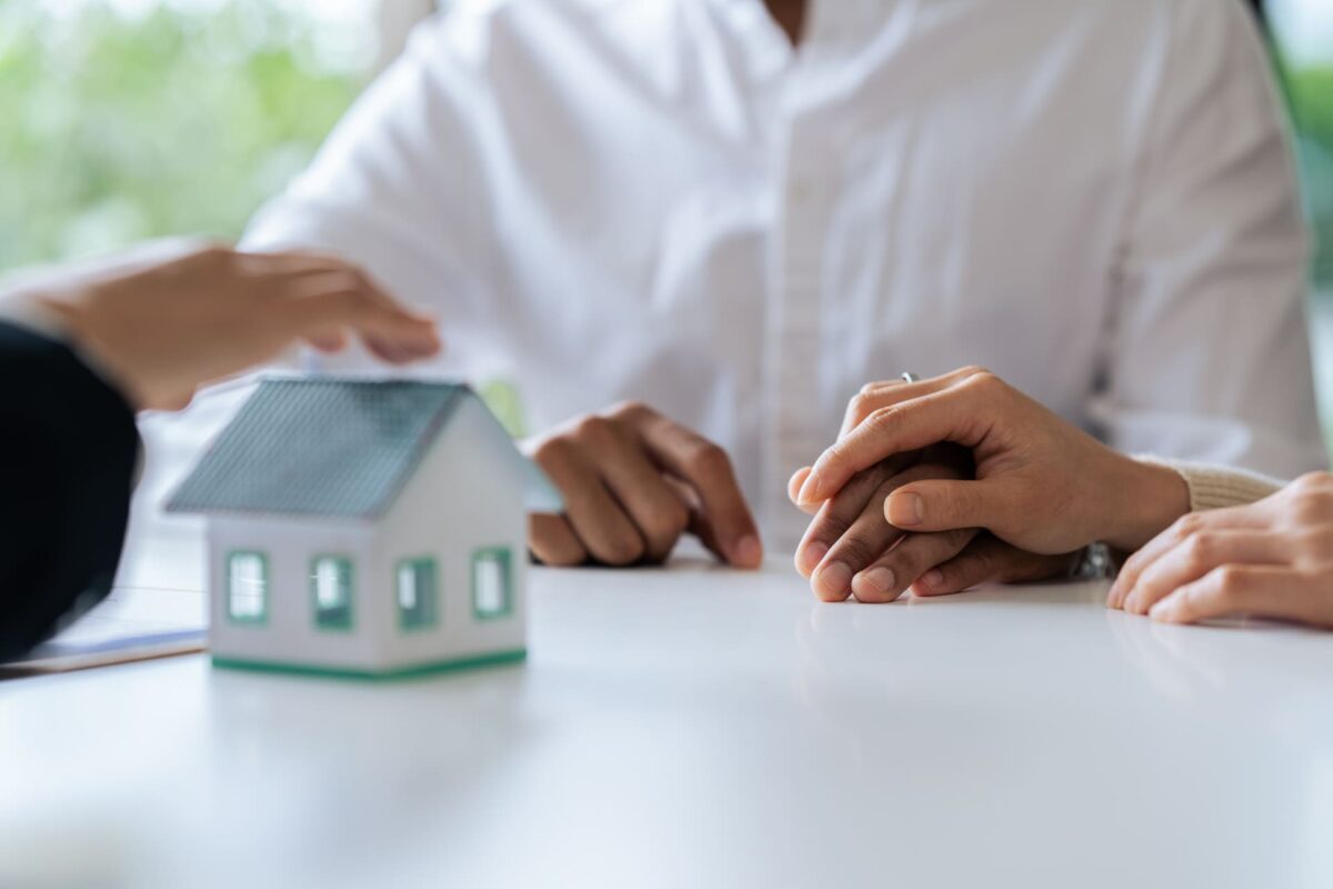young couple about to sign mortgage deal