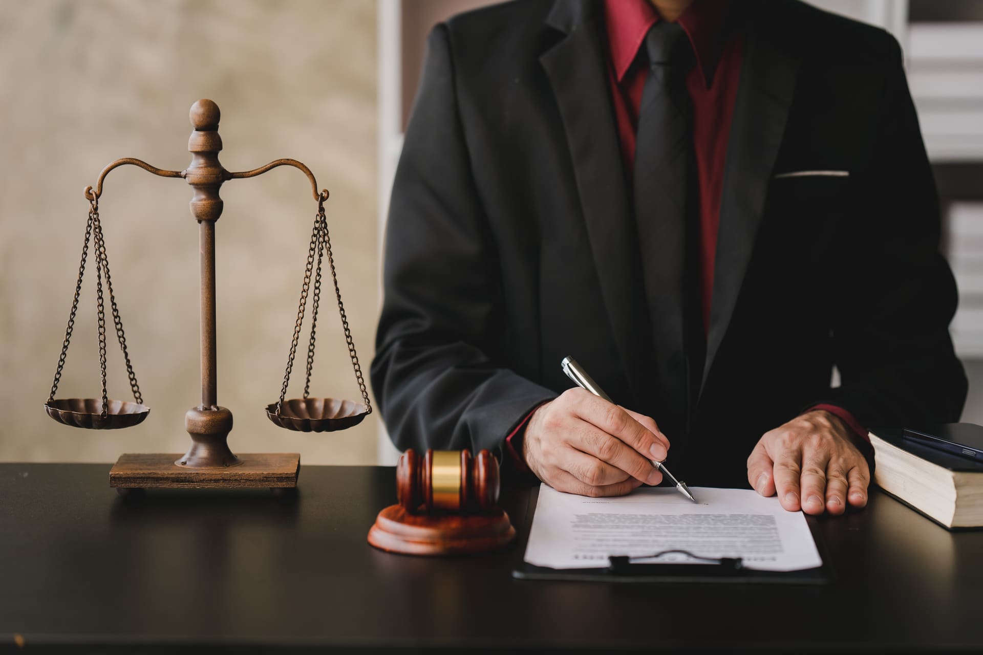 lawyer signing papers