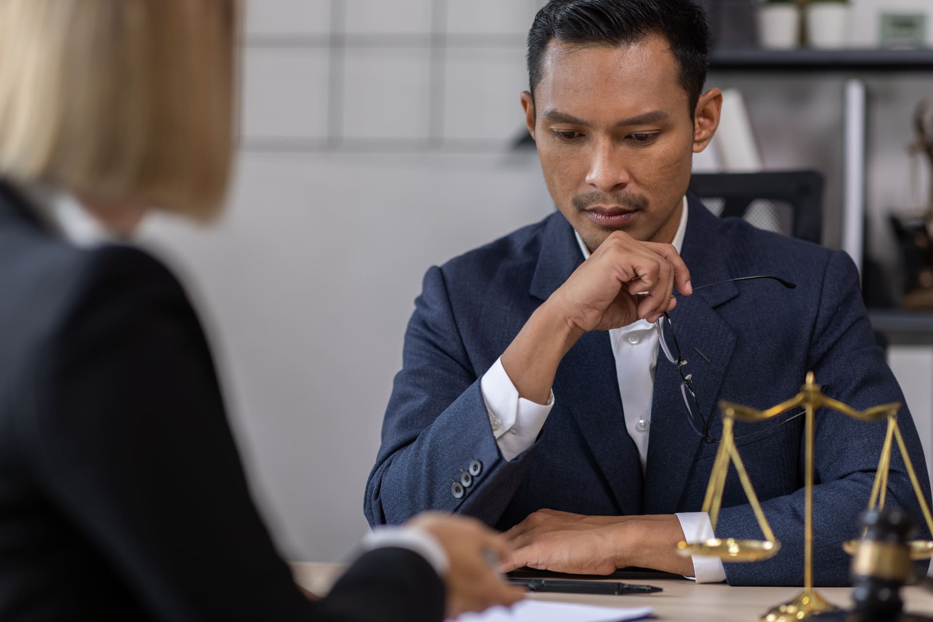 person in debt discusses options with lawyer