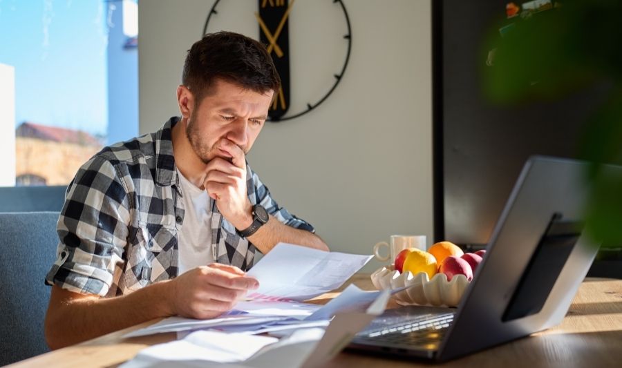 car guy reviewing repossession documents