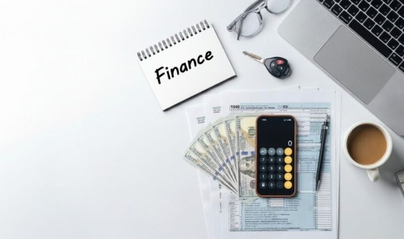 car keys and credit finance books in the table
