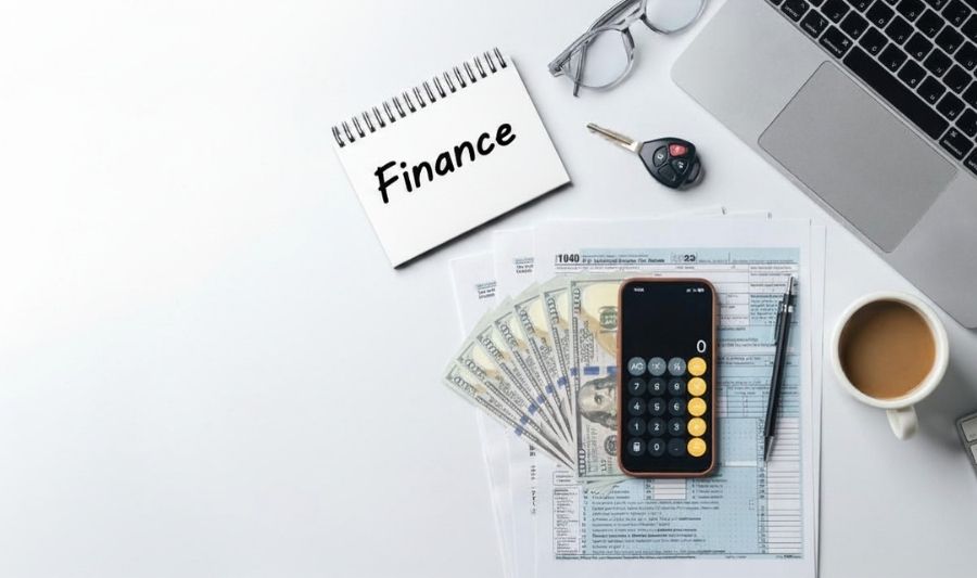 car keys and credit finance books in the table