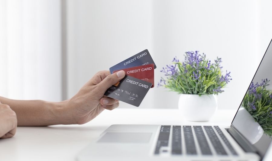 credit card in front of a laptop