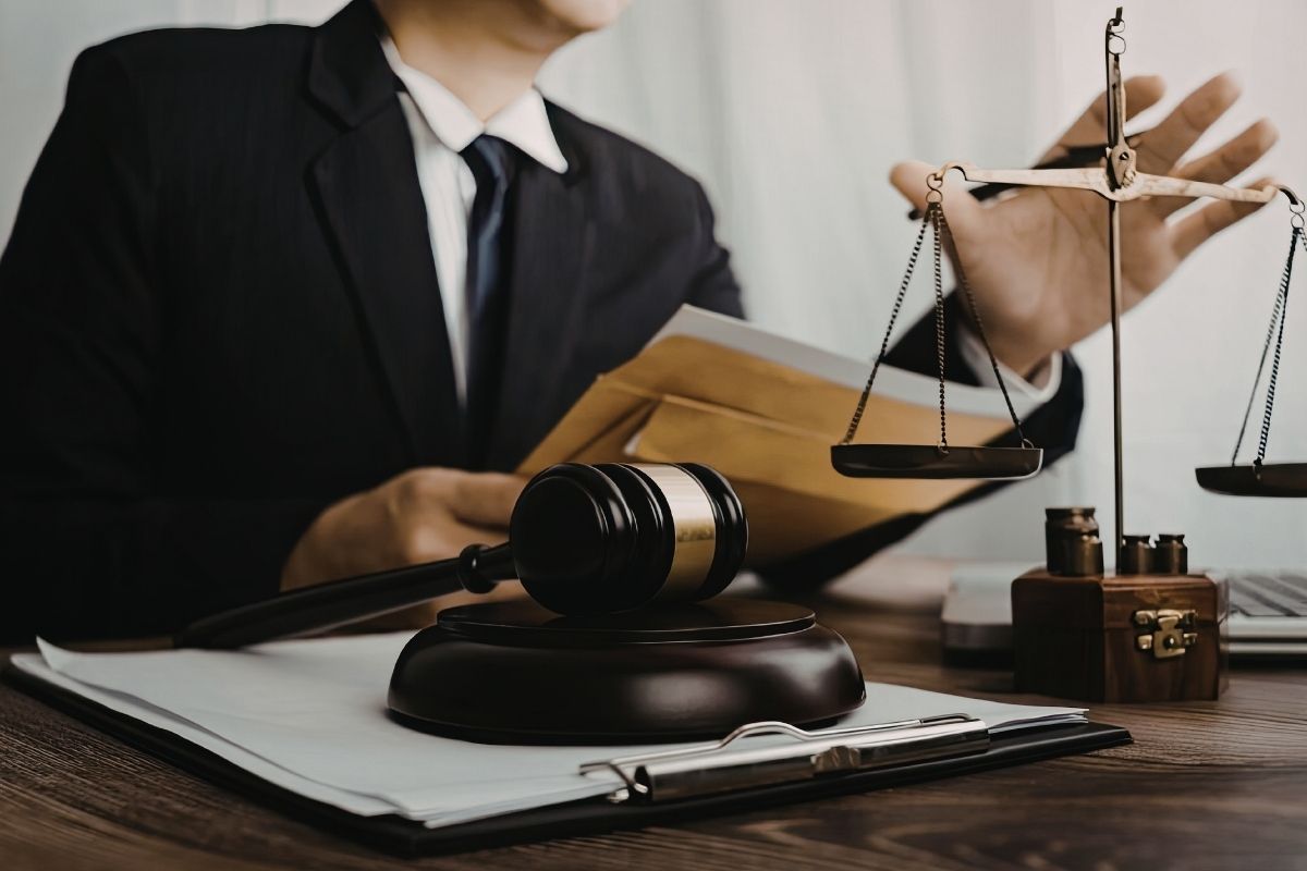 Lawyer working with legal documents and justice scales