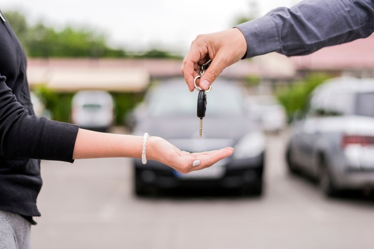 giving the key to a brand new car