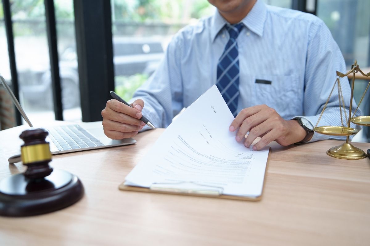 lawyer reviewing financial documents of the client