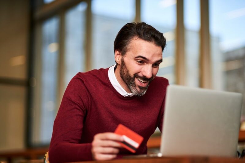 man checking his bank account online