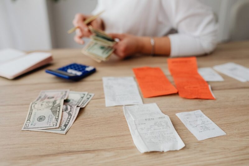 person computing and paying bills